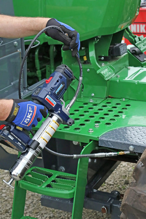 Person using the PowerLuber 20V Cordless Grease Gun With 36 Inch Hose High Output 10000 PSI Trigger Operated Two Speed.