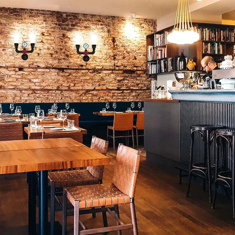 Retro Industrial Wall Lamp Sconce With Two Lights Vintage Water Pipe Design in cafe interior on brick wall