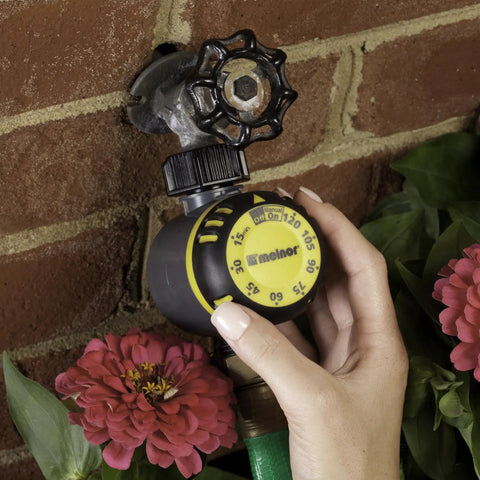 Mechanical Outdoor Timer For Irrigation With Auto Shutoff After Set Run Time installed on outdoor faucet