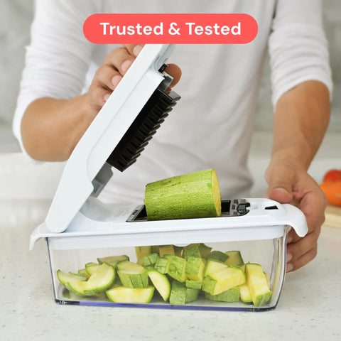 Demonstrating use of Must Have All In One Veggie Chopper With Spiralizer And Bowl Time Saving Food Chopper With Container Fruit Cutter.