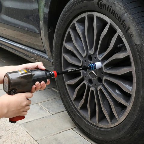 Using Five Piece One Half Inch Drive Torque Limiting Extension Bar Set With Color Coded Ends For Easy Use to tighten car wheel lug nuts.