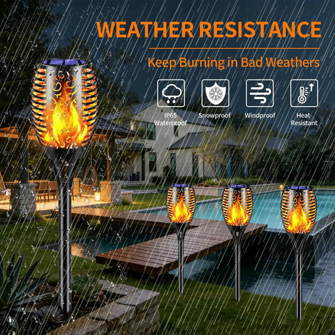 Six Pack Solar Torch Lights With Realistic Flickering Flame for Outdoor Yard Pathway Garden Patio shown in rainy weather