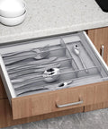 Five Compartment Mesh Silverware Drawer Organizer With Non Slip Foam Feet shown installed in kitchen drawer with utensils sorted neatly.