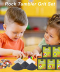 Children playing with rocks, rock tumbler grit set visible, labeled packets of grit and colorful stones on table.