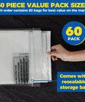 Hand holding 60 Pack 40 Inch Clear Garment Bags For Dry Cleaning Easy Clip On Plastic Clothes Covers For Hanging Suits Coats Shirts And Pants Wrinkle Free Protection During Travel And Storage