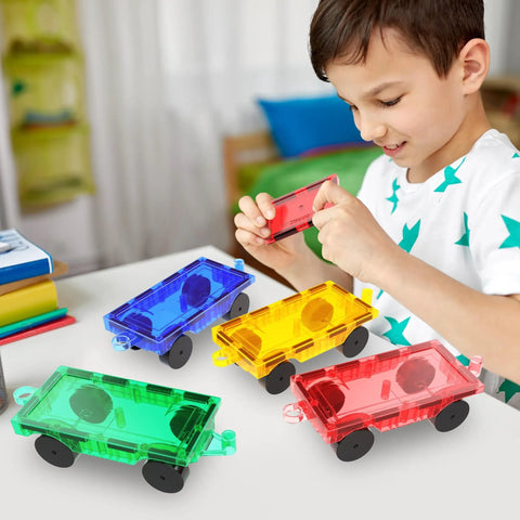 Child playing with Four Piece Magnetic Car and Truck Base Tiles Set for Creative Building and Movable Vehicles, compatible with magnet sets