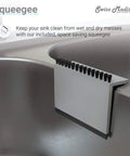 Squeegee attached to stainless steel kitchen sink edge for cleaning, shown on Ouvert 25 By 22 Inch Stainless Steel Kitchen Sink Single Basin Top Mount With Rear Center Drain 18 Gauge Heavy Duty Built To Last Rounded Corners For Easy Cleaning Everyday Use.