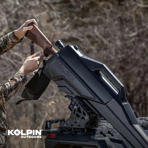 Person placing a rifle into Stronghold Gun Boot L With Autolatch Mount Black Hard Case For Long Guns Up To 52 Inches on ATV