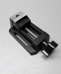 Compact Table Vise For Bench And Drill Press, Mini Precision Vise For Jewelry Hobbyists, Zinc Die Cast Construction, Grips Small Parts With Horizontal And Vertical V Grooves, Mounting Slots With Bolts Washers And Wing Nuts Included on silver surface
