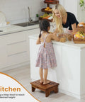 Child using 6.5 Inch Wooden Step Stool For Adults No Assembly Required Handy Boost To Reach High Shelves 500 Lbs Capacity One Step Stool For Bed Riser Kitchen Bath Elderly Seniors Kids Acacia Wood in kitchen