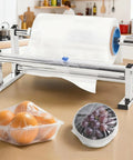 Manual Stretch Film Winding Machine With Sliding Cutter For Easy Packaging Durable Film Dispenser in kitchen setting