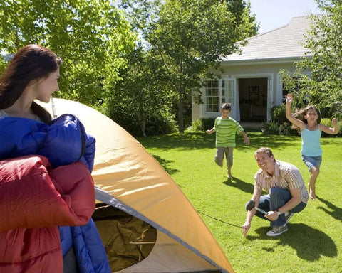 Family setting up a tent using Heavy Duty 9 Inch Metal Tent Stakes, 25 Pack, Anti Rust Galvanized Steel Ground Stakes in sunny backyard