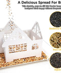 Heavy Duty Metal Outdoor Bird Feeder With Solar Lights shown with assorted seeds in a house-shaped design.