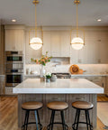 Slick Brass Pendant Light For Kitchen Island With Adjustable Height And Soft Frosted Glass Globe Ceiling Lamp For Dining Room Entryway Bedroom Modern Hanging Fixture Top Shelf Home Decor in stylish kitchen setting.