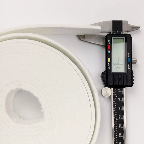 Side view of Lynn Manufacturing ceramic fiber gasket strip on roll, white, 1 in x 1/8 in x 200 in for boiler/stove.