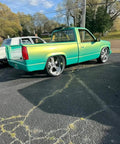 Rich Jade Green Basecoat Paint Gallon Drop In Ready To Spray applied to a truck with chrome wheels and sleek finish.
