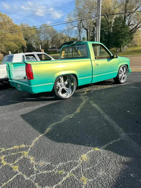 Rich Jade Green Basecoat Paint Gallon Drop In Ready To Spray applied to a truck with chrome wheels and sleek finish.