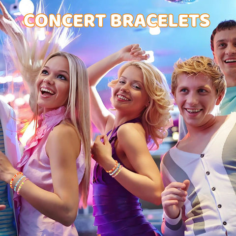 Group of friends wearing colorful concert bracelets, smiling and dancing at a party.