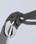 Close-up of 16 Inch XL Red Self Locking Water Pump Pliers With 27 Adjustment Positions gripping a metal plate