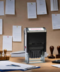Slick No Sweat Self Inking Paid Stamp With Date And Check Number Heavy Duty Two Color Refillable Ink Pad on office desk.