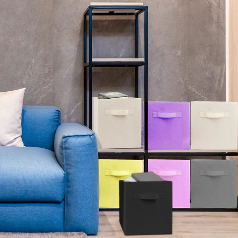 Super Durable Collapsible Storage Cubes 10.5 Inch Foldable Fabric Bins in a stylish living room setting with a blue couch.
