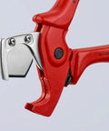 Close-up of red pipe cutter for flexible pipes and hoses up to 1 inch exterior diameter with spring loaded opening and locking lever