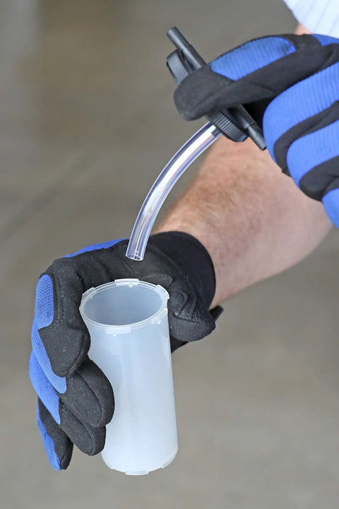 Heavy Duty Hand Vacuum Pump Brake Bleeder Kit With Gearless Diaphragm Gauge And Dead Simple One Finger Release For Quick Automotive Tune Ups and Badass Garage Wrenchin, showing glove holding reservoir tube.