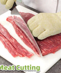 Ultra Durable ANSI Cut Resistant Gloves With 10X Reinforced Food Grade Safety for meat cutting, size M on a kitchen counter.