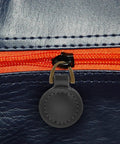 Five Piece Set Of Badass Black Alloy Zipper Pull Replacement Tabs For Heavy Duty Backpacks, close-up of zipper with black tab.