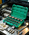 Heavy Duty 12 Point Socket Set Mechanic Tool Kit With Storage Case Adapter, steel sockets in green case on engine bay table
