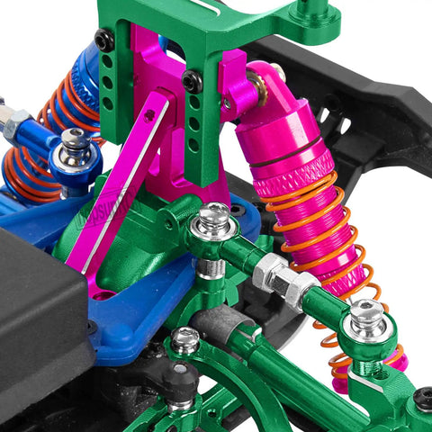 Close-up of Pro Grade Aluminum Front and Rear Full Metal Shocks with Shock Tower Upgrade Kit, pink finish, on 1/18 LaTrax Teton Prerunner RC.