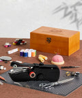 Grab-and-Go Handheld Sewing Machine Kit With 142 Piece Essentials, Wooden Storage Box, Dual Power Supply, Electric Switch, Heavy-Duty Scissors, Assorted Needles And Threads For Quick Home Repairs, with black handheld machine and wooden box