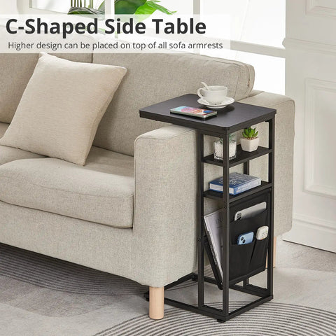 C Shaped End Table With Three Tiers And Storage Bag easily slides under sofa beside beige couch for space saving