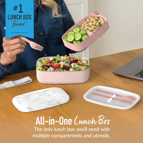 Blush marble three compartment adult lunch box with built-in utensils and sealing strap shown with fresh salad and cucumbers.