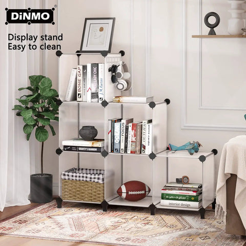 Six Cube Storage Organizer Bookcase And Display Shelf With Wooden Mallet For Home Office Bedroom Bathroom White Great For Books Toys Clothes Shoes Decor And Everyday Cabinet Storage with books and decor items.