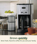 Brew Central 12-Cup Programmable Coffeemaker With Auto Shutoff, glass carafe on counter, brushed chrome finish, easy-to-use controls.