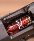 Close-up of red 9mm Pistol Snap Caps Reusable Dummy Rounds for Safe Dry Fire showing in chamber