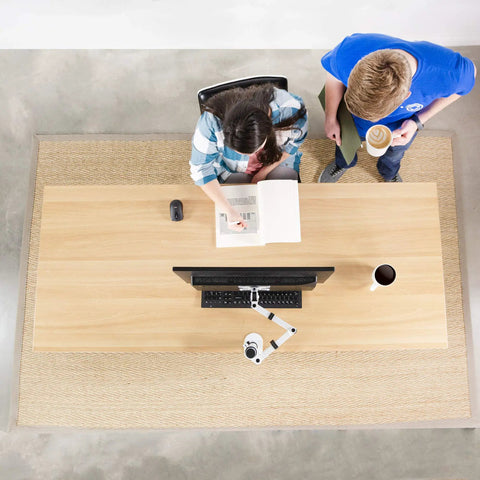 Top view of desktop with Heavy Hitter Single Monitor Desk Mount With Smooth Tilt And Swivel For Screens Up To 32 Inch Or 38 Inch Ultrawide Displays.