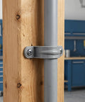 Thirty Pack Real Heavy Duty Three Quarter Inch Pvc Conduit Clamps Flexible Two Hole U Clip Pipe Mounting Straps close-up on wood.