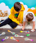Children playing with Science Theme LED Finger Lights 32 Pack With 8 Colors And 8 Designs Ideal For Kids Party Favors Birthday