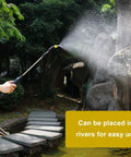Person using Go-To Electric Garden Sprayer For Easy Watering And Dosing, 9.8Ft Hose, Adjustable Spray, in garden setting