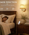 Hassle Free Battery Operated Wall Sconces Set Of Two Matte Gold Rechargeable Cordless Indoor And Outdoor Lighting Fixtures For Modern Home Decor Super Easy Install Warm Glow Lamp Pair next to sleeping person in a bedroom.