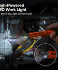 Hand holding high-powered LED work light in dim environment for industrial safety, not a gas leak detector.