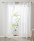 Cozy Farmhouse Polyester Linen Blend Sheer Curtains 84 Inch Long installed, light filtering beige panels in a living room setting