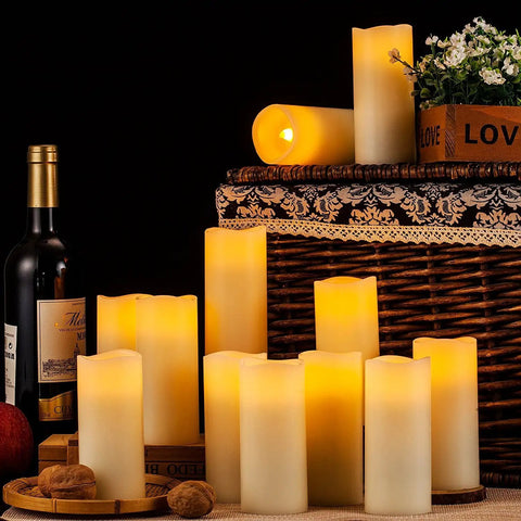 Flameless LED Candles Set Of 12 Ivory Real Wax Pillar Candles 2.2 Inch Diameter By 5 Inch Tall with warm glow on woven basket display