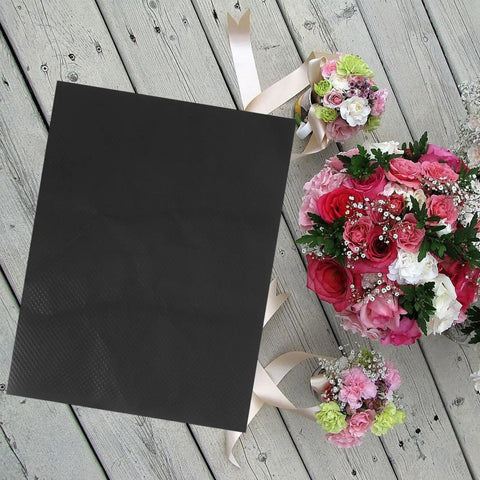 10 Piece Floral Embossed Kraft Paper Sheets With Polka Dot Texture For Bouquet Wrapping and colorful bouquets on wooden floor.