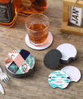 100 Piece Sublimation Blank Cup Coaster Set Bulk Neoprene Mats For Sublimation Transfer Heat Press Printing DIY Crafts 3.93 Inch Square Non Slip Bottom Durable displayed on wooden table with glass and bottle