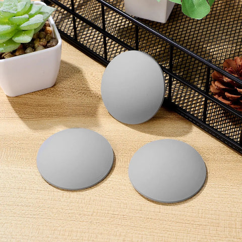 Gray Silicone Door Handle Buffer Guards 4 Pack Self Adhesive Wall Protectors shown on a wooden surface