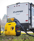 Ultralight 2500-Watt Inverter Generator With Quiet Tech near RV, showing portability and use for camping power.