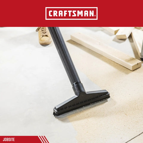 Floor Brush Attachment For Two And Half Inch Wet Dry Vac With Industrial Grade Fourteen Inch Wide Brush cleaning a surface